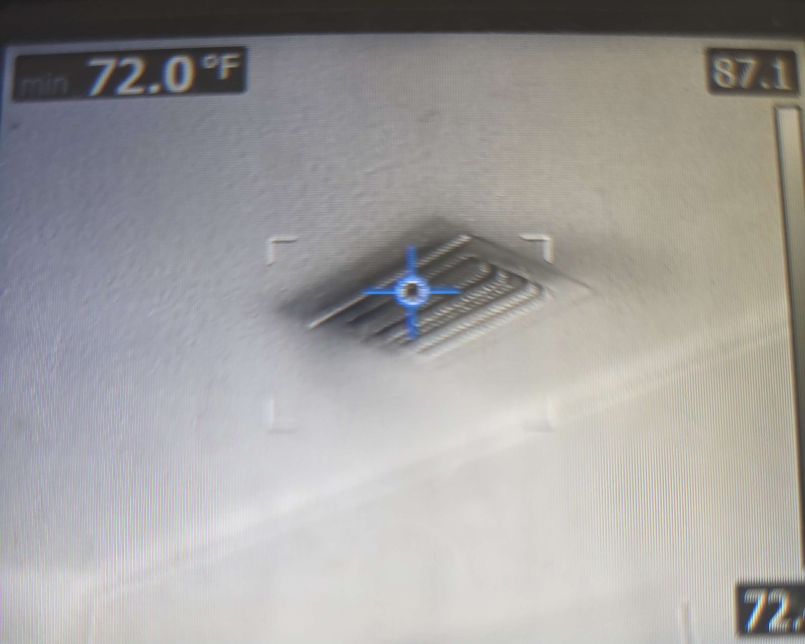 Thermal camera reading of a ceiling AC supply vent during an inspection