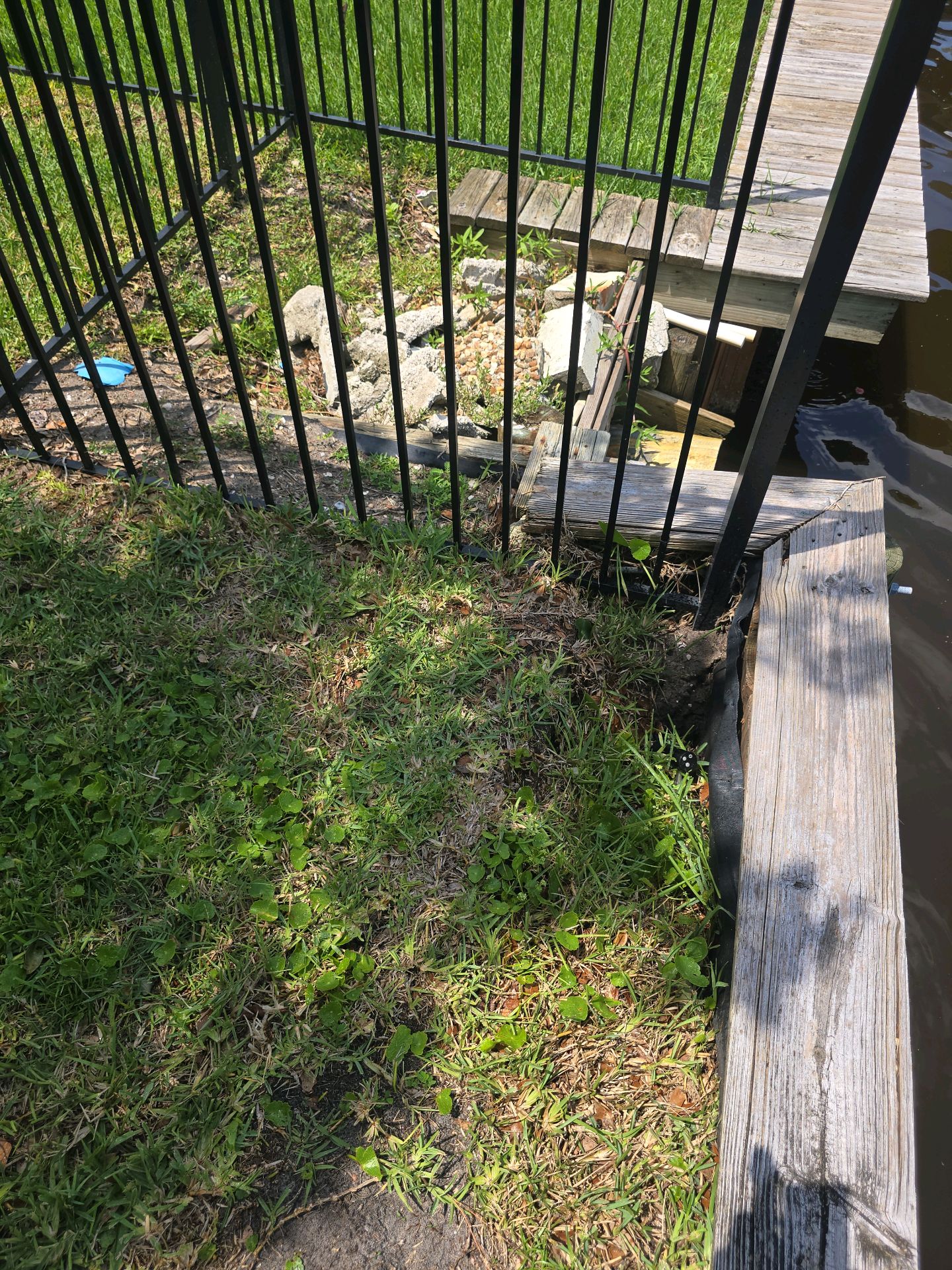 Soil erosion and displacement at a waterfront bulkhead corner
